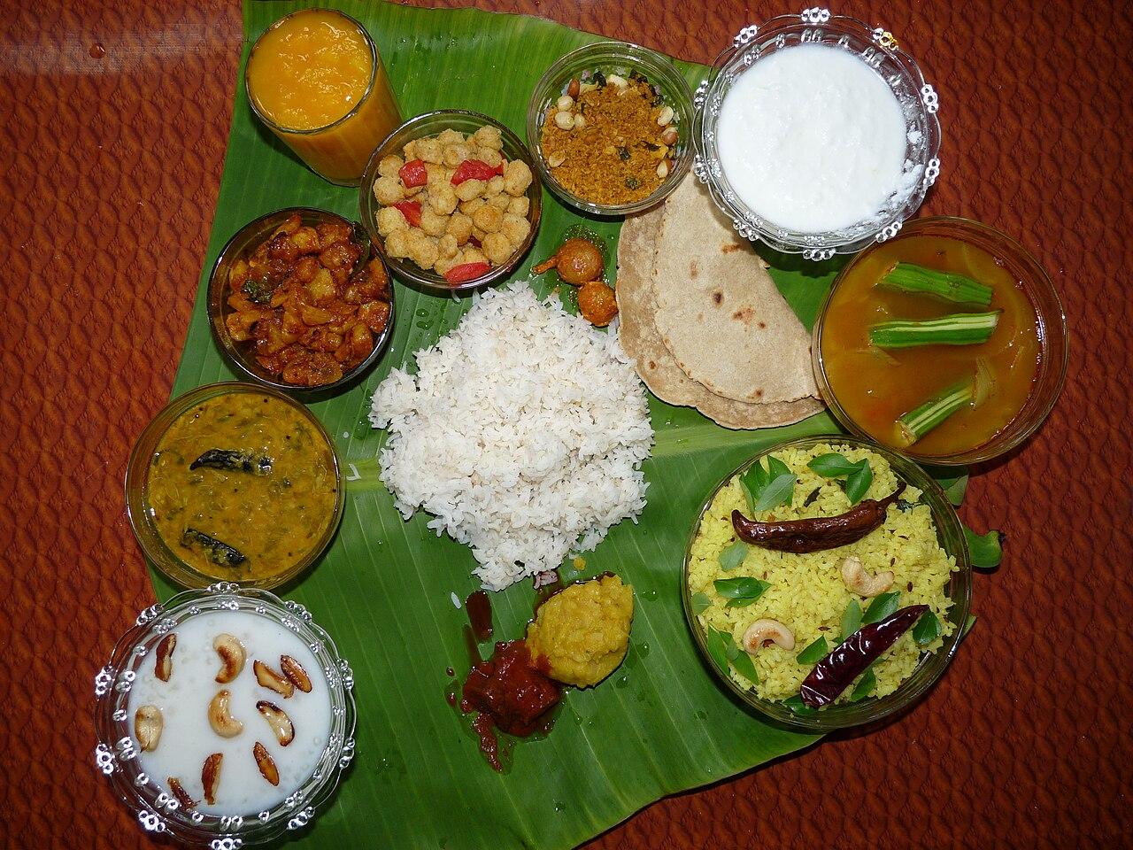An Andhra meal served on a banana leaf with rice, curries, pickle and curd