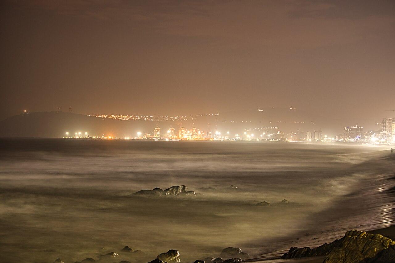 Visakhapatnam port lights seen across the water from Ramakrishna Beach at night